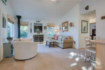 Open floor plan with vaulted ceiling