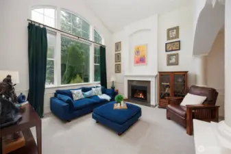 Grand formal living room offers vaulted ceilings and extra large picture windows.
