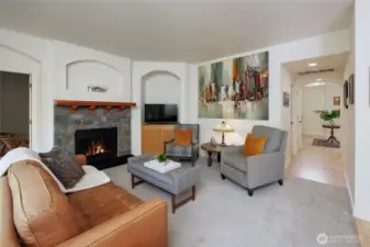 Cozy family room with adjacent main floor den or guest room.