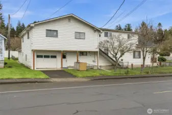 Triplex with garage, fenced yard on corner lot in downtown Cathlamet.