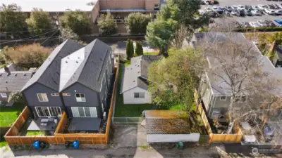 Aerial view from the alley showing garage and back of the house.   Lot is prime for development with townhomes or just live in a great house with so much potential to build in the future - added value now or later!