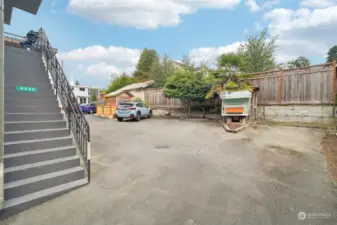 The two spaces on either side of the chicken coup are this unit's reserved parking spaces.