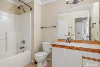 Main bathroom with ample counterspace and neutral color palate.