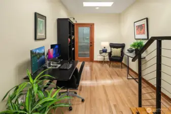 Large main floor office with sky lights to drench the space in rich sunshine.