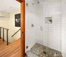 Tasteful 3/4 bath in the upper guest suite.