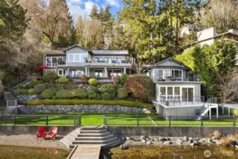Gorgeous main house and beach cottage with 100' of waterfront, massive flat lawn and sandy beach.  Badminton anyone??