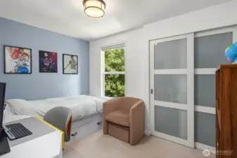 This upper-level room offers a peaceful retreat, featuring fresh paint, updated flooring, and ample closet space. Perfect for restful nights, productive days, or creative uses tailored to your needs.