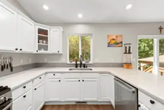 Quartz countertop with undermount sink.