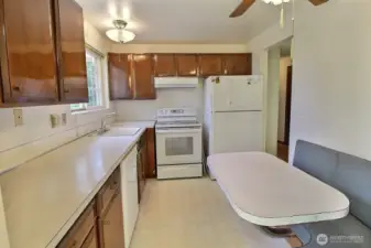 Kitchen with built in eating space.
