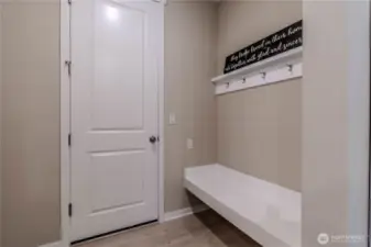Garage door with coat rack and bench