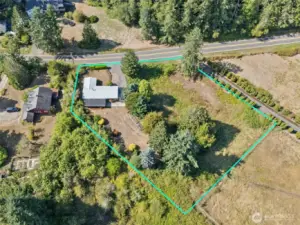 This lot-line view shows the full property and makes it clear the defined pasture behind belongs to the next parcel, not this one. What you do get is 1.36 acres of your own, with lawn, gardens, and pasture space tucked inside your boundary.