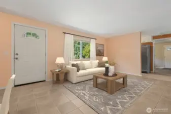 Up close, the front entry shows off its arched glass door and large picture window, while the wall to the right keeps the kitchen fridge and storage zone tucked away. Call it the pantry side, or just a smart way to keep the workhorse part of the kitchen from stealing the spotlight.