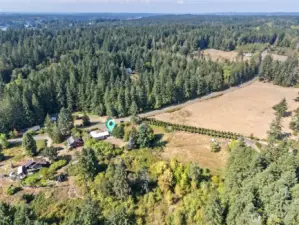 Behind the home, the aerial captures the areas for pasture, perfect for grazing or reimagining into your own private estate setup. Whether that means animals, gardens, or a little bit of both, the land is ready.