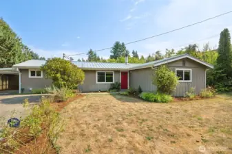 The carport sits just off to the side, blending into a home that delivers easy one-story living. A wired security system is in place, ready to be reactivated, which means less hassle and more peace of mind.