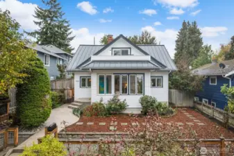 1913 Craftsman style home features low maintenance fully fenced yard, metal roof and peek Sound views.