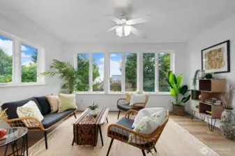 Charming sun porch expands the living area and offers peek views of the Sound and Olympics.