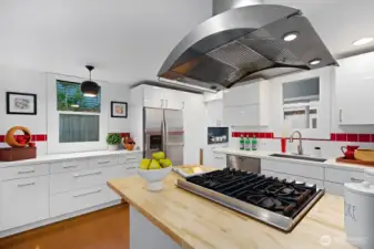 The kitchen has been recently updated with a butcher block counter. Plenty of cabinet space, Viking range, excellent lighting and good working space.