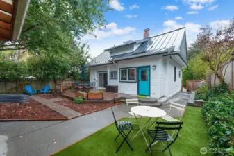 Low maintenance yard, big deck, planting beds and great areas to play, relax and entertain. Completely fenced!