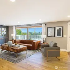 Upper level living room offers valley and mountain views. (Staged to Scale)