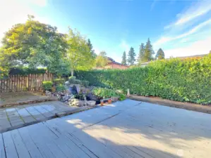 Upper level backyard completely finished with wood and pavers eliminating pesky mud on wet days.