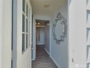 Designated lower level entrance adjacent to garage door.