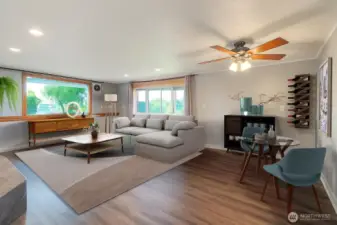 Lower level living and dining combine space offers plenty of elbow room. (Staged to Scale)