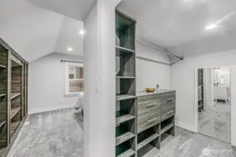 Primary Bedroom closet with built in shelving