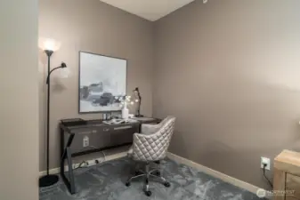 Primary bedroom - spacious enough for a desk setup or additional seating