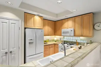 Here catching all of the kitchen including the double door pantry. Plenty of ceiling and  under cabinet lighting.