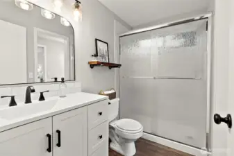 Beautifully Remodeled Bathroom with New Vanity, Shower, Light Fixtures and More!