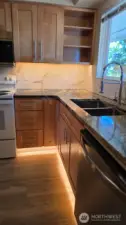 Unit 4 Fully Renovateed Kitchen with floors, cabinets, countertops and backsplash and lighting!
