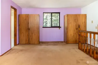 Primary bedroom loft with full bath.