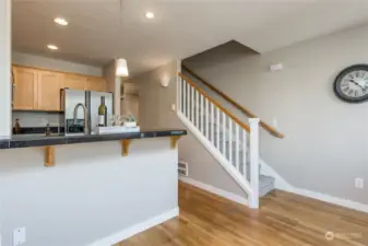 Stairs lead up to primary bedroom and 2nd bedroom