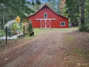 View of the barn with covered horse wash station to the right.