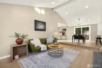 Upon entering you are greeted with an open concept living space with vaulted ceilings