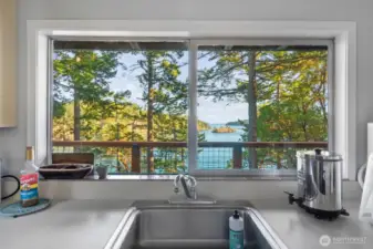 View of the ocean while cleaning up after family meals.