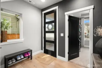 Main floor bedroom with 3/4 bath off of the entry