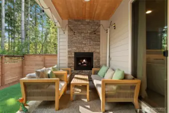 Imagine drinking your morning coffee next to this cozy outdoor fireplace!
