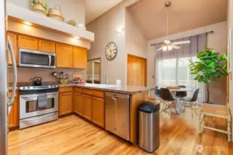 Large kitchen with granite counters, SS appliances and a sky light.