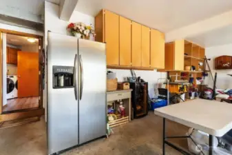 Large 3 car garage with built in overhead cabinets.