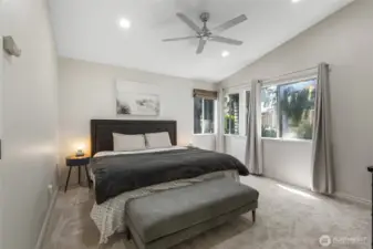 Primary bedroom with vaulted ceilings