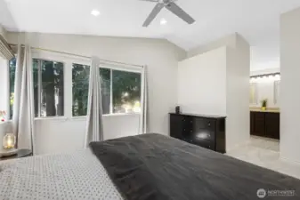 Primary bedroom with vaulted ceilings