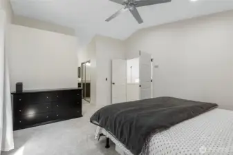 Primary bedroom with vaulted ceilings