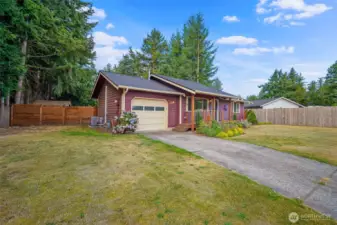 Attached garage and paved driveway.