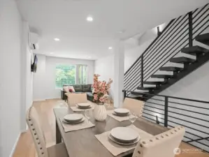Beautiful, bright dining & living areas with floating staircase.