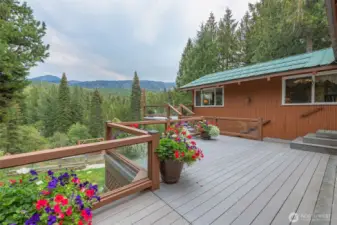 Impressive, generous composite and concrete decking wraps around the home to enjoy those incredible views!