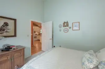 First guest bedroom is light & bright with vaulted ceiling