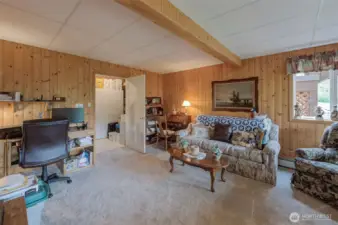 Lower level family room also has an attached utility room and a door to the covered patio facing the river (not shown).