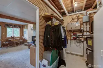 Lower level family room also has an attached utility room that is PERFECT for doubling as a snowmobile mudroom with concrete floor and warmth from radiant heat hub! All storage cabinets stay.