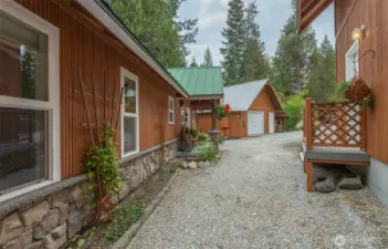 The side door on the detached 2-story garage is only a few steps from your front entry (workshop shown in the distance)